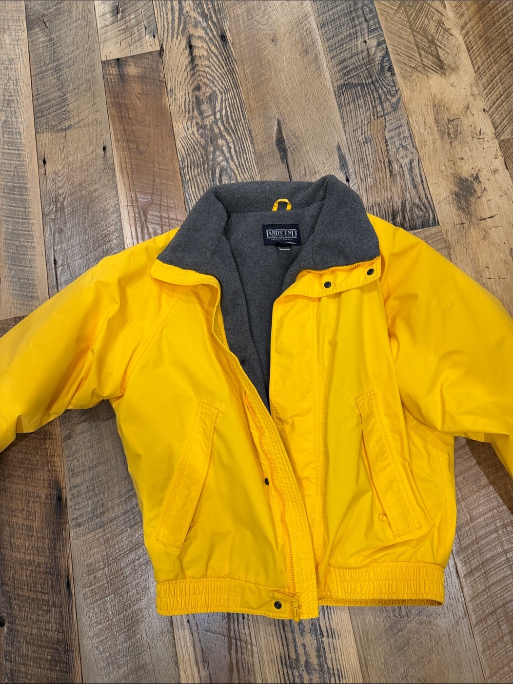 Lands' End Bright Yellow Squall Jacket with Gray Fleece lining.
